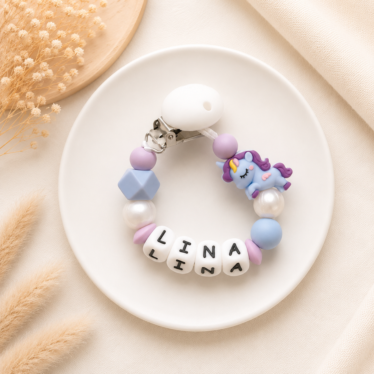 Blauw en paars speenkoord met naam Lina en unicorn figuur
