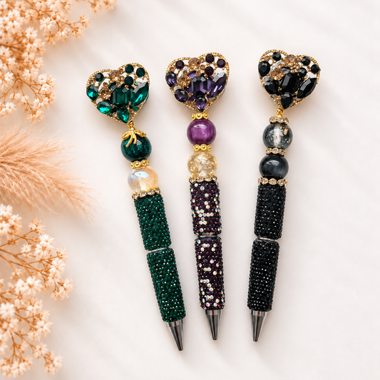 Luxe kralenpennen Emerald Muse in groen, paars en zwart met fonkelende hartdecoratie